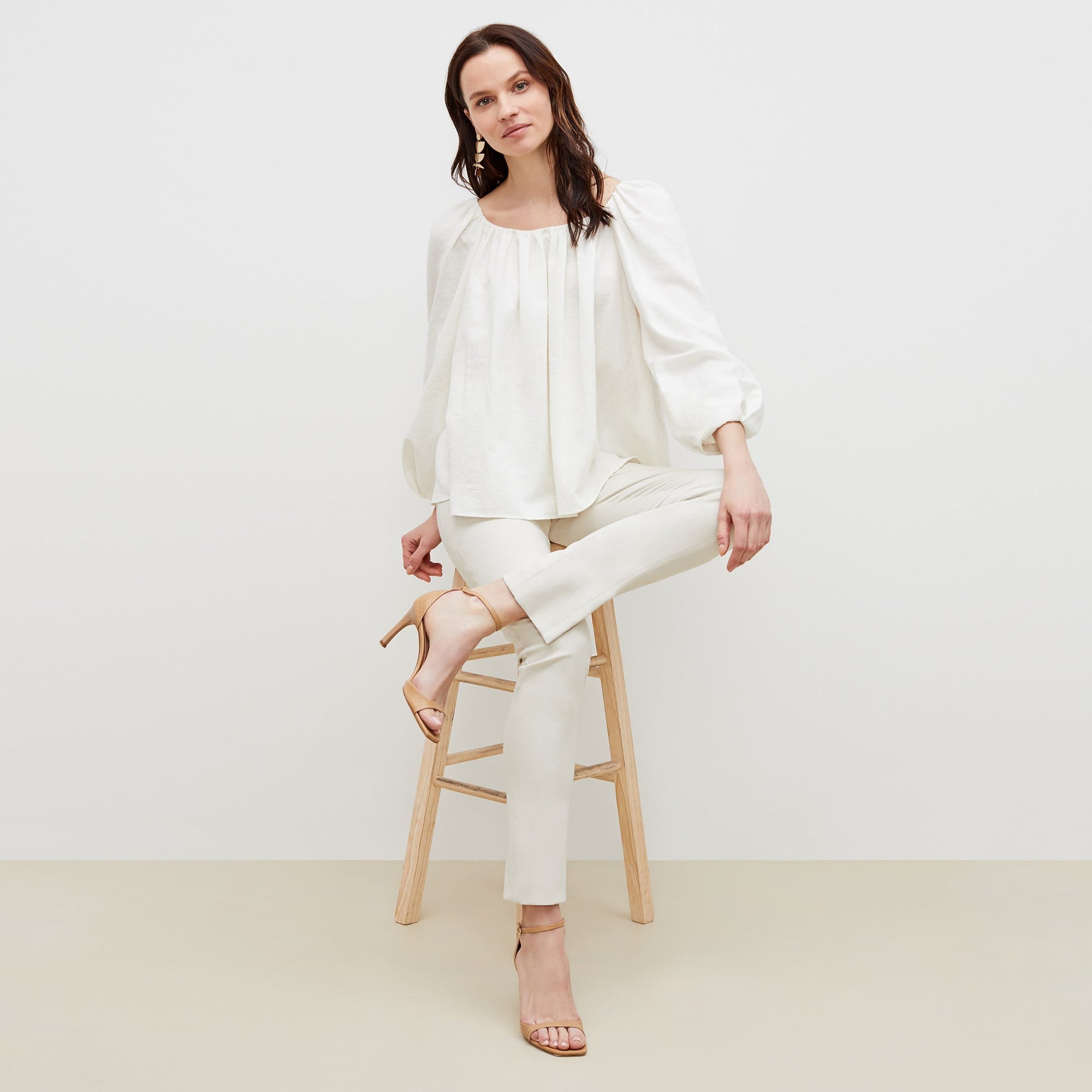 Front image of a woman standing wearing the foster pant in bone | Exclude