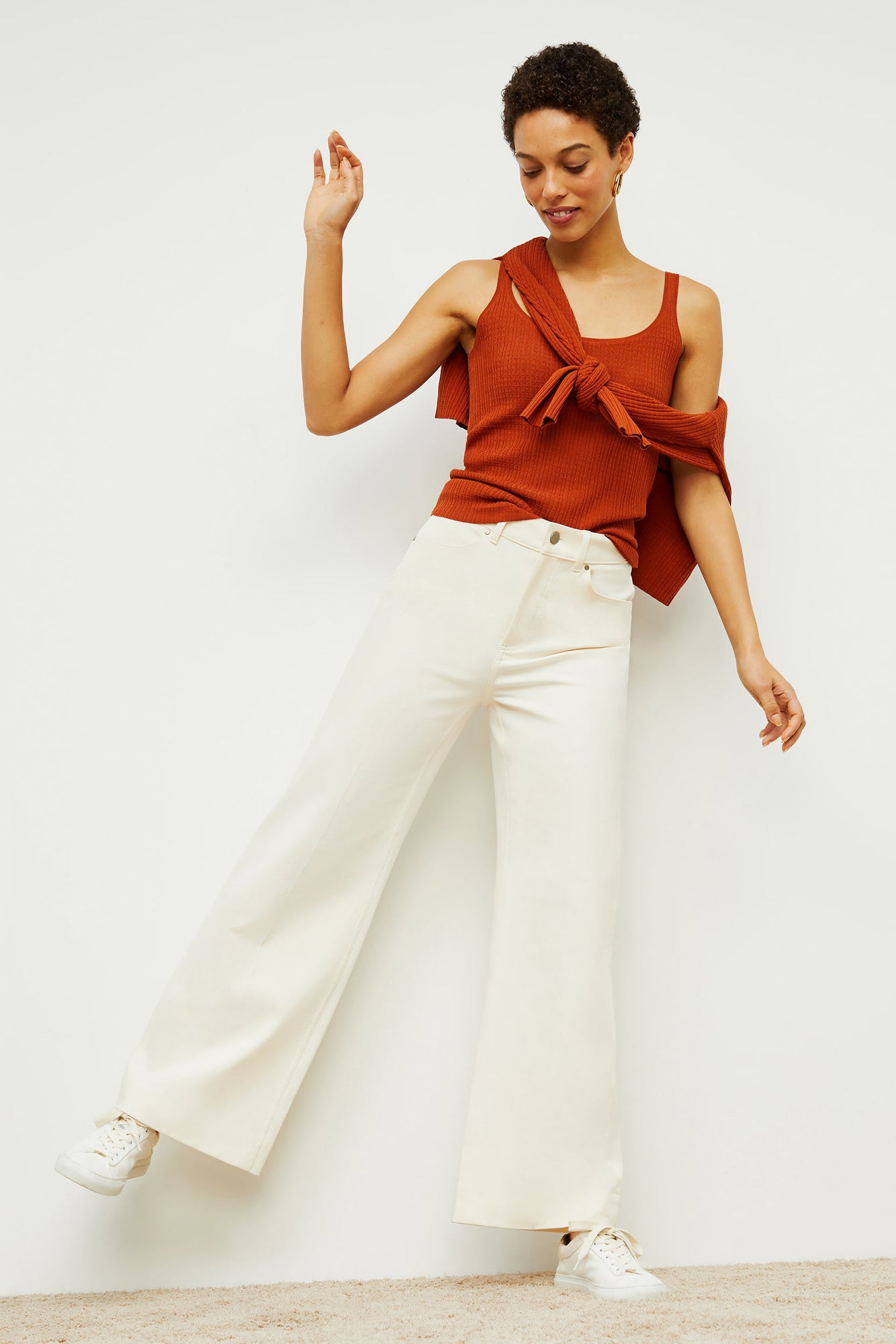 Back image of a woman standing wearing the milo jean in tusk | Exclude
