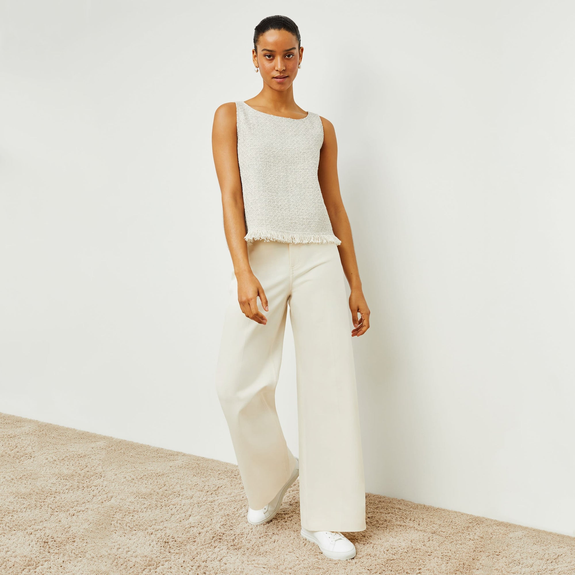 Front image of a woman standing wearing the milo jean in tusk | Exclude