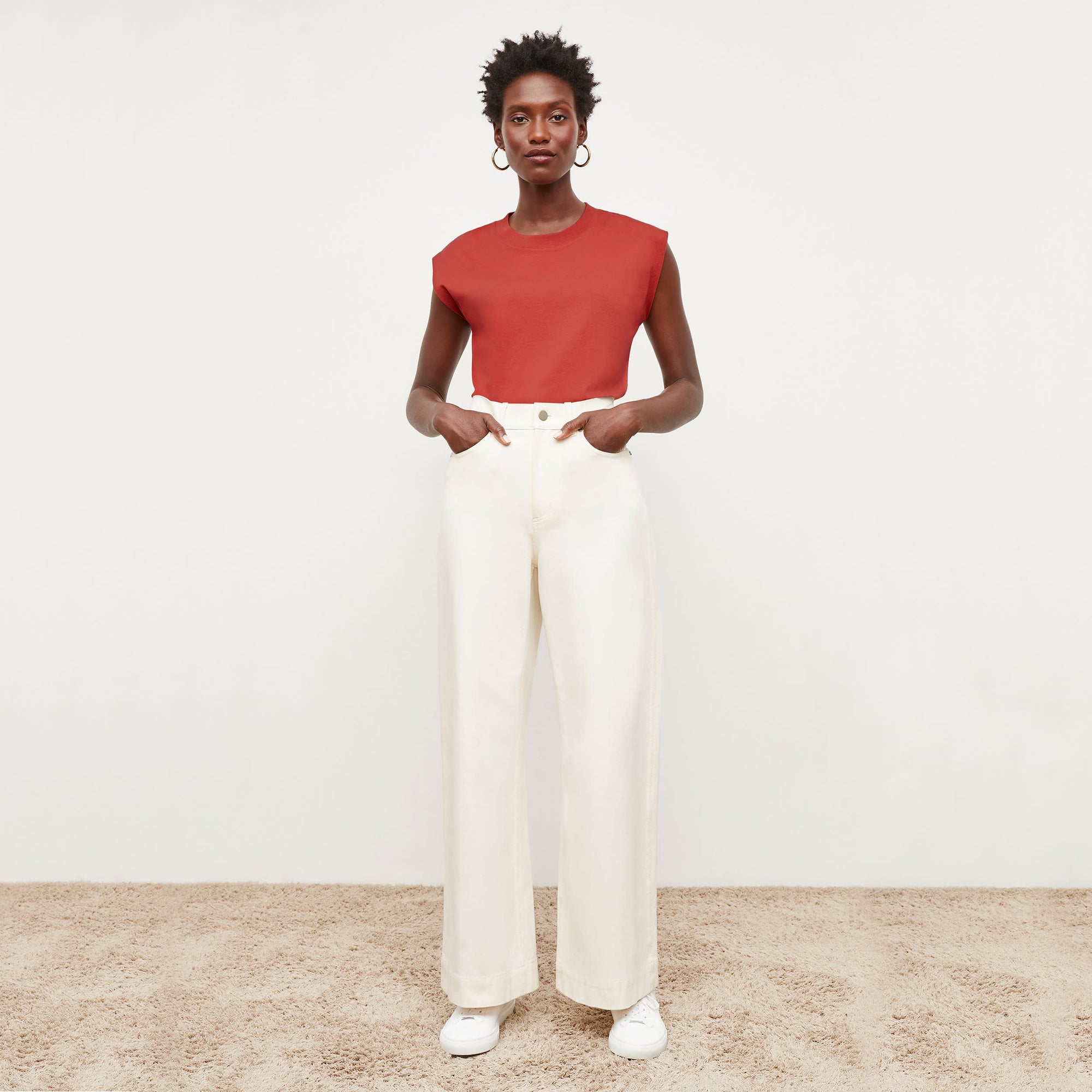 Front image of a woman standing wearing the milo jean in tusk | Exclude