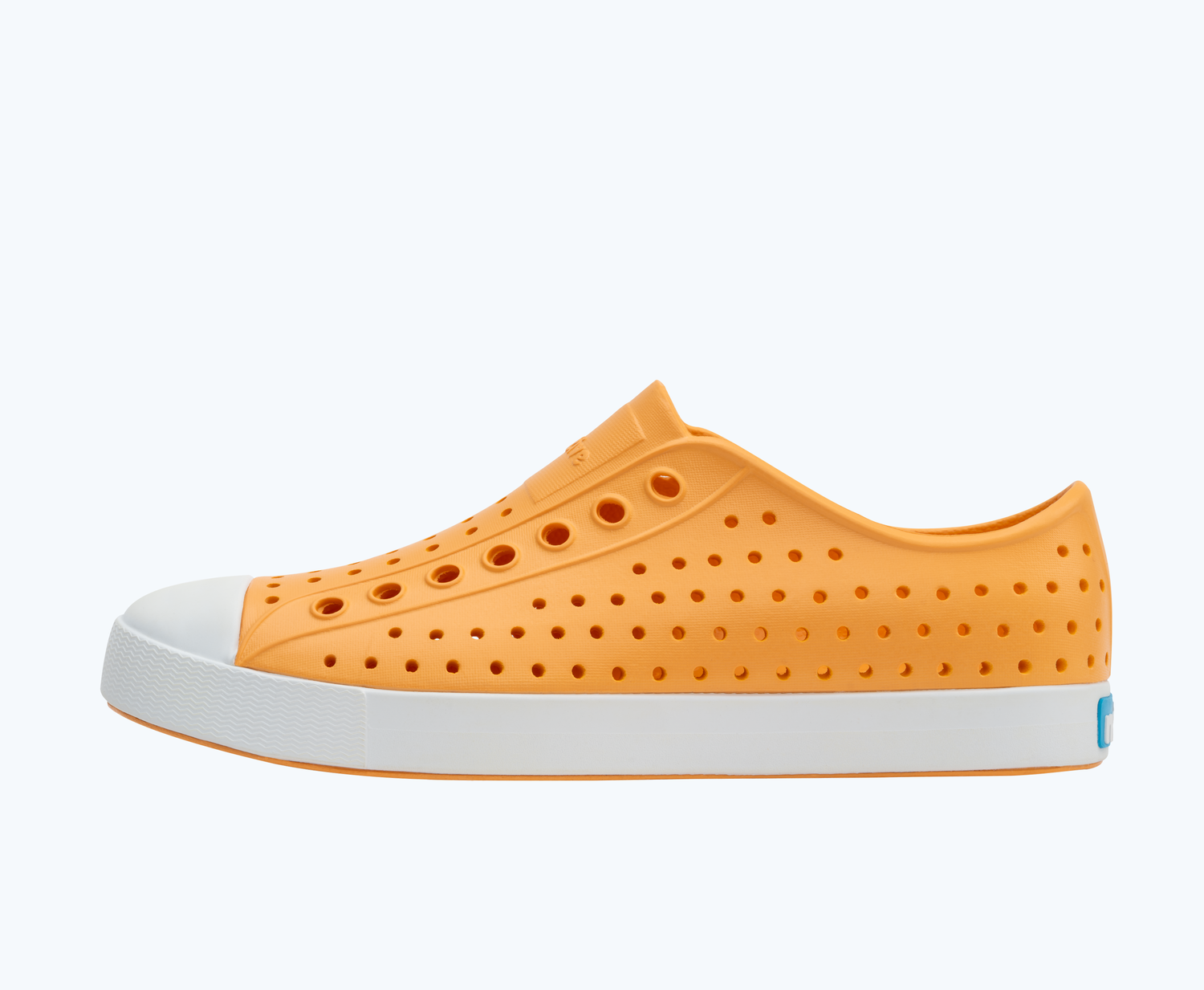 Side view of a Native Shoes Adults Jefferson | Papaya Orange/ Shell White Footwear