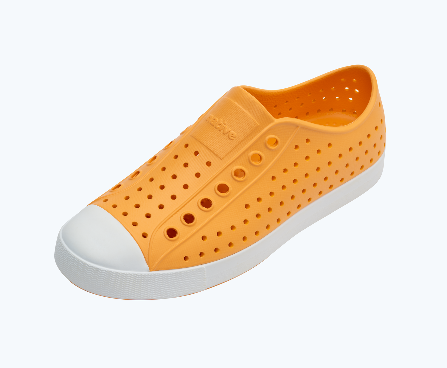 Angled view of a Native Shoes Jefferson | Papaya Orange/ Shell White Footwear