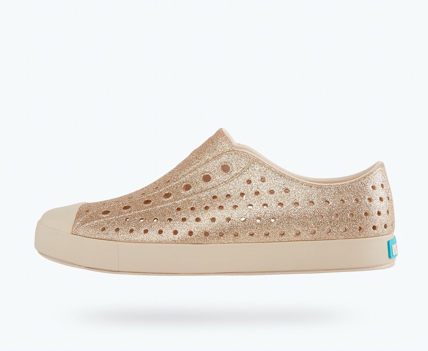 Side view of a Native Shoes Adults Jefferson Bling | Rock Salt Bling/ Rock Salt Pink Footwear
