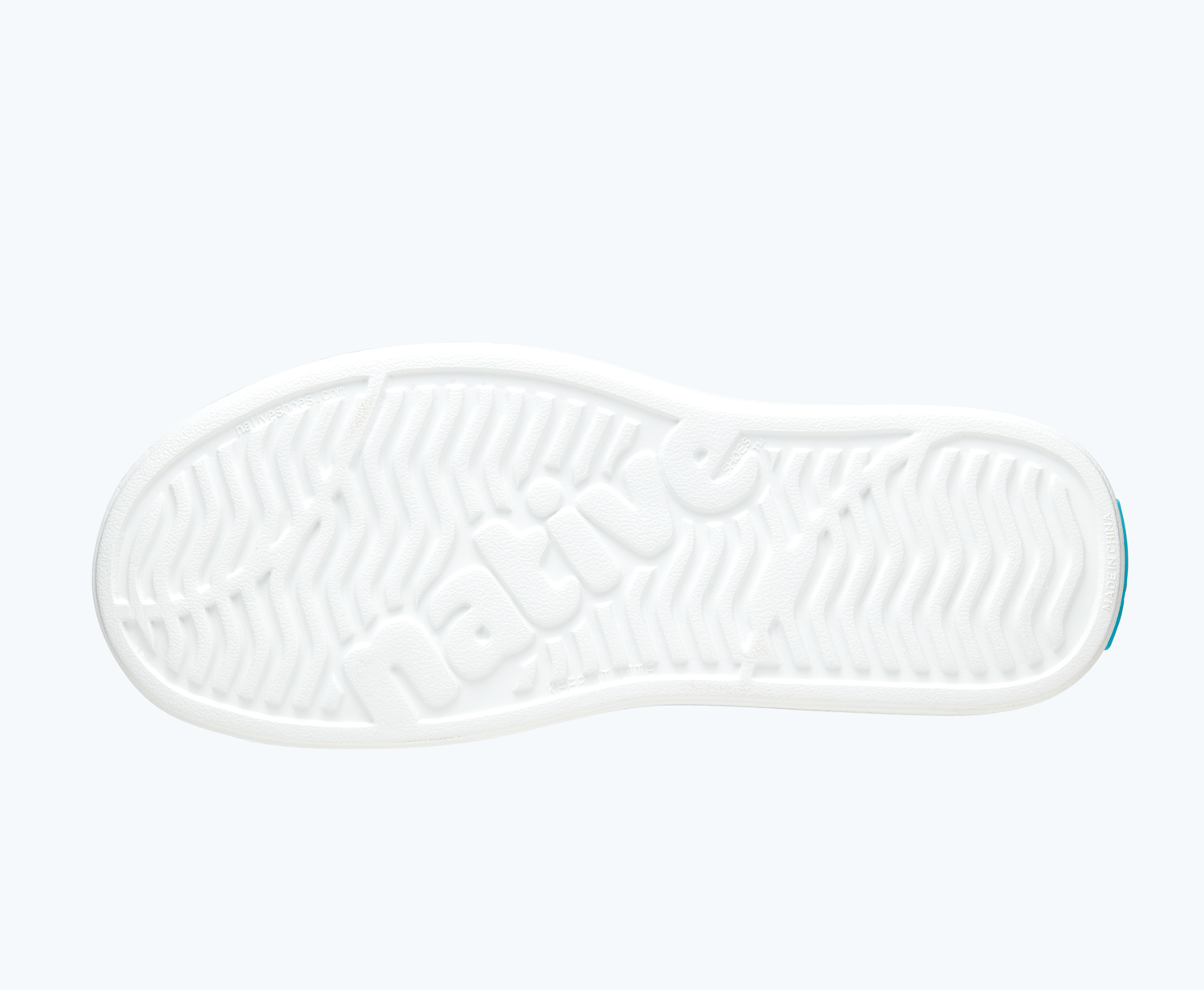Bottom view of a Native Shoes Miles Print | Shell White/ Shell White/ Orange Tie Dye Footwear
