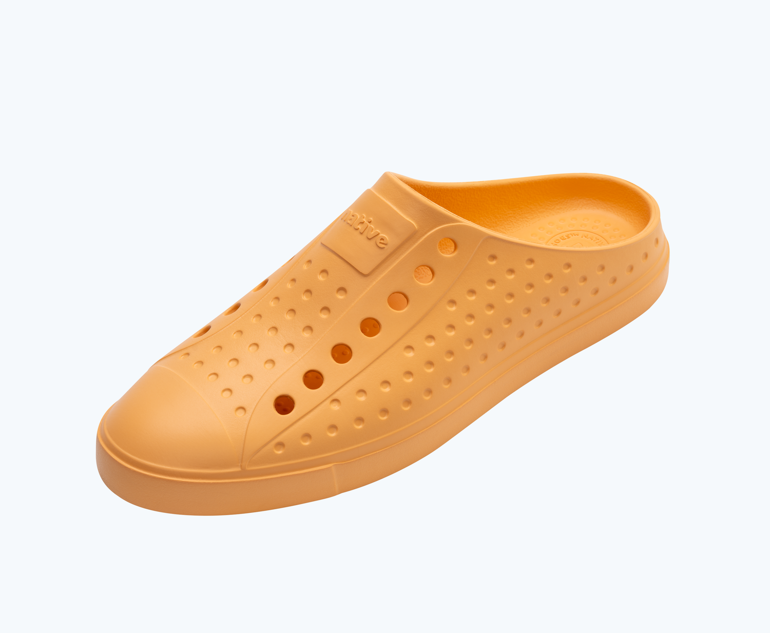 Angled view of a Native Shoes Jefferson Clog | Papaya Orange Footwear