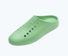 Angled view of a Native Shoes Jefferson Clog | Candy Green Footwear
