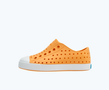 Side view of a Native Shoes Kids Jefferson Kids | Papaya Orange/ Shell White Footwear