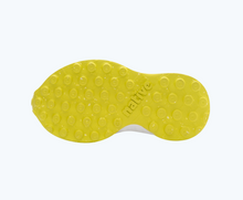 Bottom view of a Native Shoes Kids Robbie Sugarlite Glow Kids | Jiffy Black/ Shell White/ Shell Lightning Glow/ Pickle Speckle Rubber Footwear