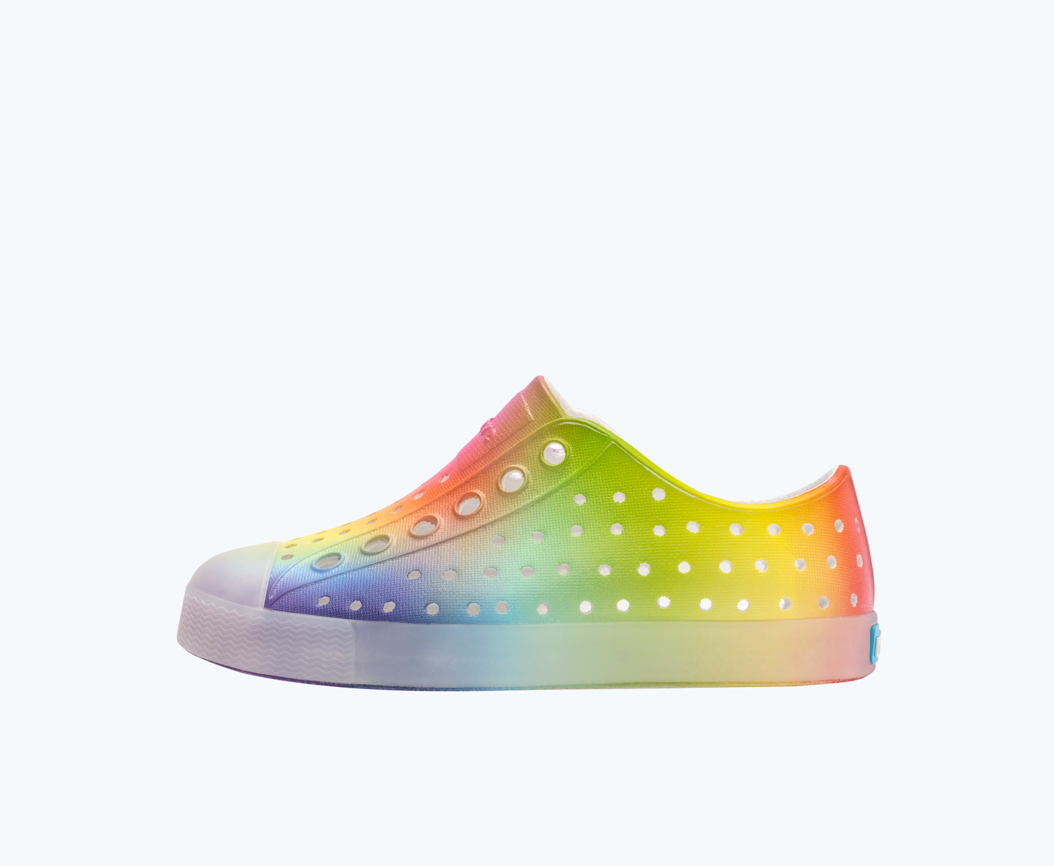 Side view of a Native Shoes Kids Jefferson Print Kids | Shell White/ Translucent/ Rainbow Blur Footwear