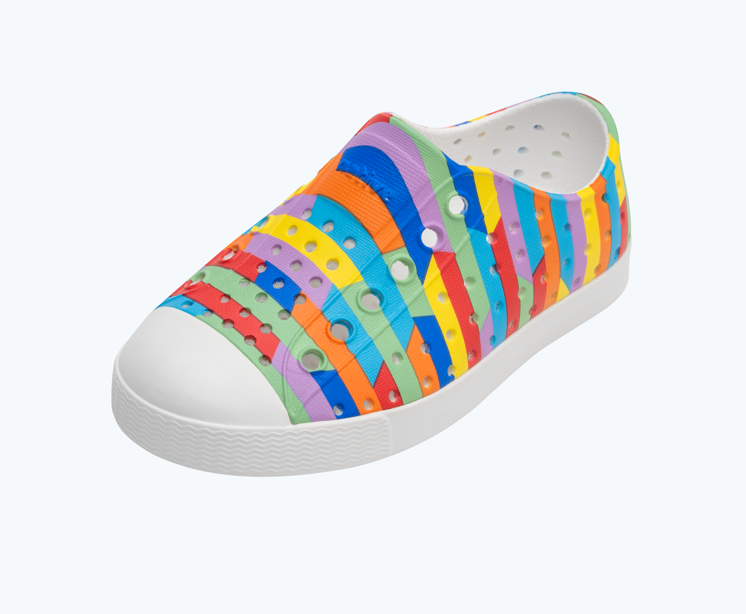 Angled view of a Native Shoes Kids Jefferson Print Kids | Shell White/ Shell White/ Rainbow Multi Stripe 2 Footwear