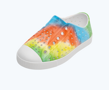 Angled view of a Native Shoes Kids Jefferson Print Kids | Shell White/ Shell White/ Rainbow Tie Dye Footwear