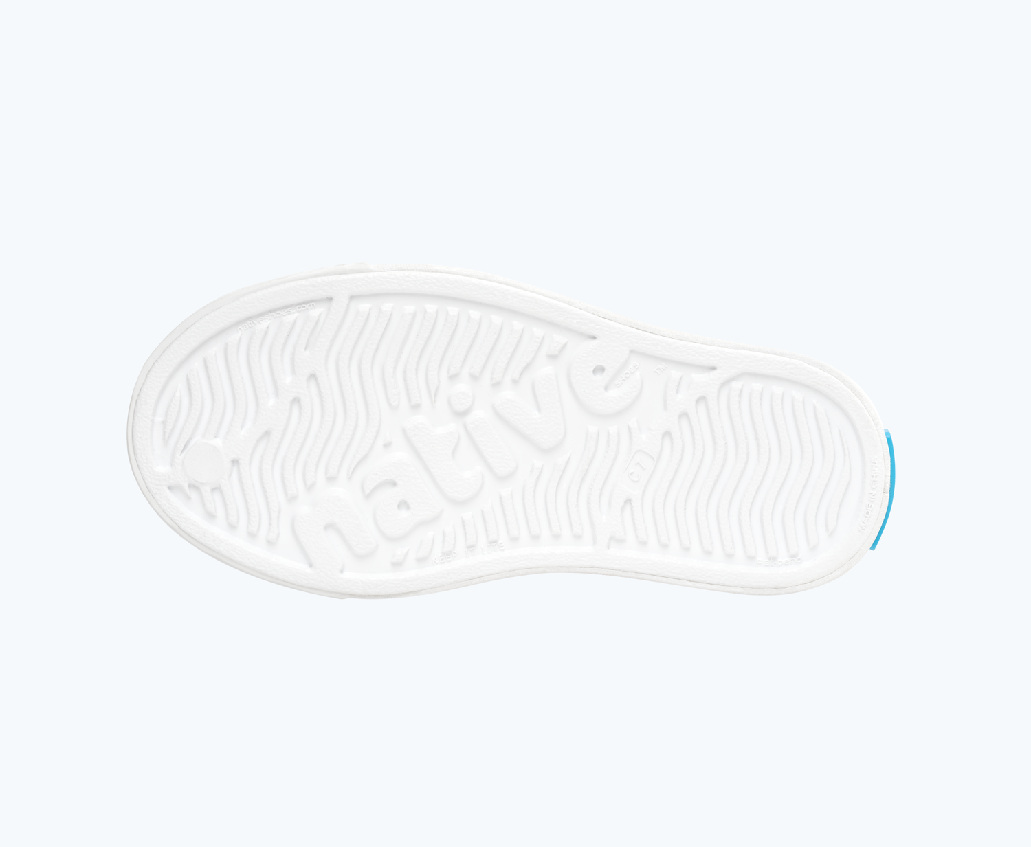Bottom view of a Native Shoes Kids Jefferson Print Kids | Shell White/ Shell White/ Rainbow Tie Dye Footwear