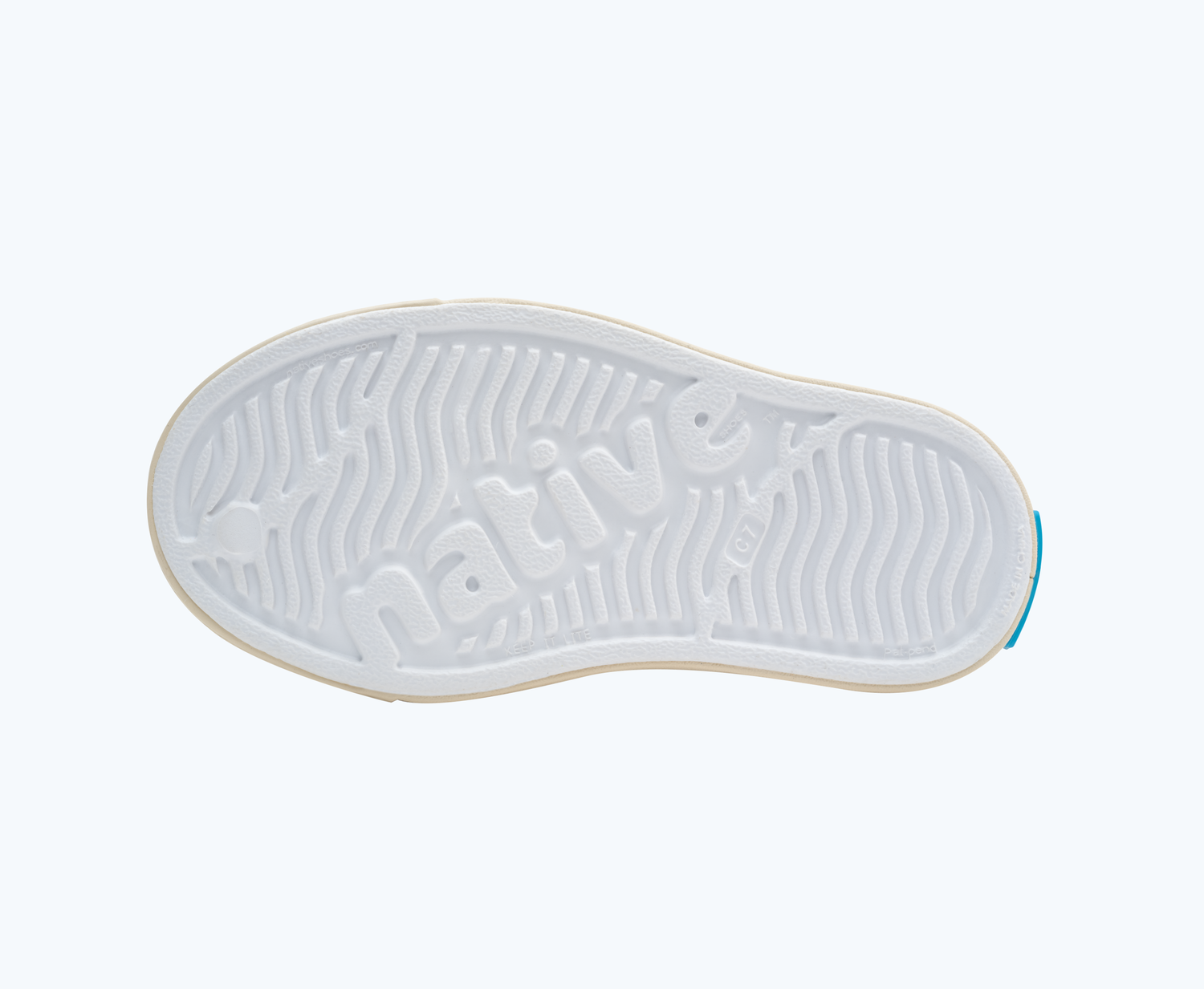 Bottom view of a Native Shoes Kids Jefferson Print Kids | Shell White/ Bone White/ Candy Safari Friends Footwear