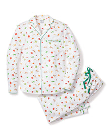 The Mens Twill Pajama Set in Shades of Autumn by Petite Plume showcases autumnal hues with its floral print of red, green, and yellow blooms. The long-sleeve top features green piping and a chest pocket, while the pants are adorned with a green ribbon tie at the waist.
