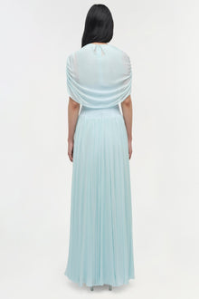 Light blue maxi dress with draped cape overlay and pleated skirt, shown from back view.