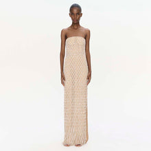 Strapless beige mesh maxi dress with all-over diamond pattern and fringe hem.