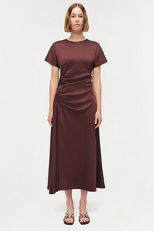 Burgundy satin midi dress with short sleeves, crew neckline, and ruched side detailing on the bodice.