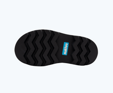 Bottom view of a Native Shoes Kids Kensington Treklite Glow Kids | Jiffy Black/ Jiffy Black/ Shell Lightning Xl Glow Footwear