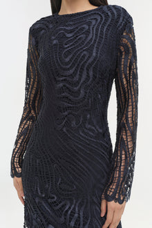 Navy lace dress with long sleeves, intricate geometric embroidered pattern, and sheer lace panels.