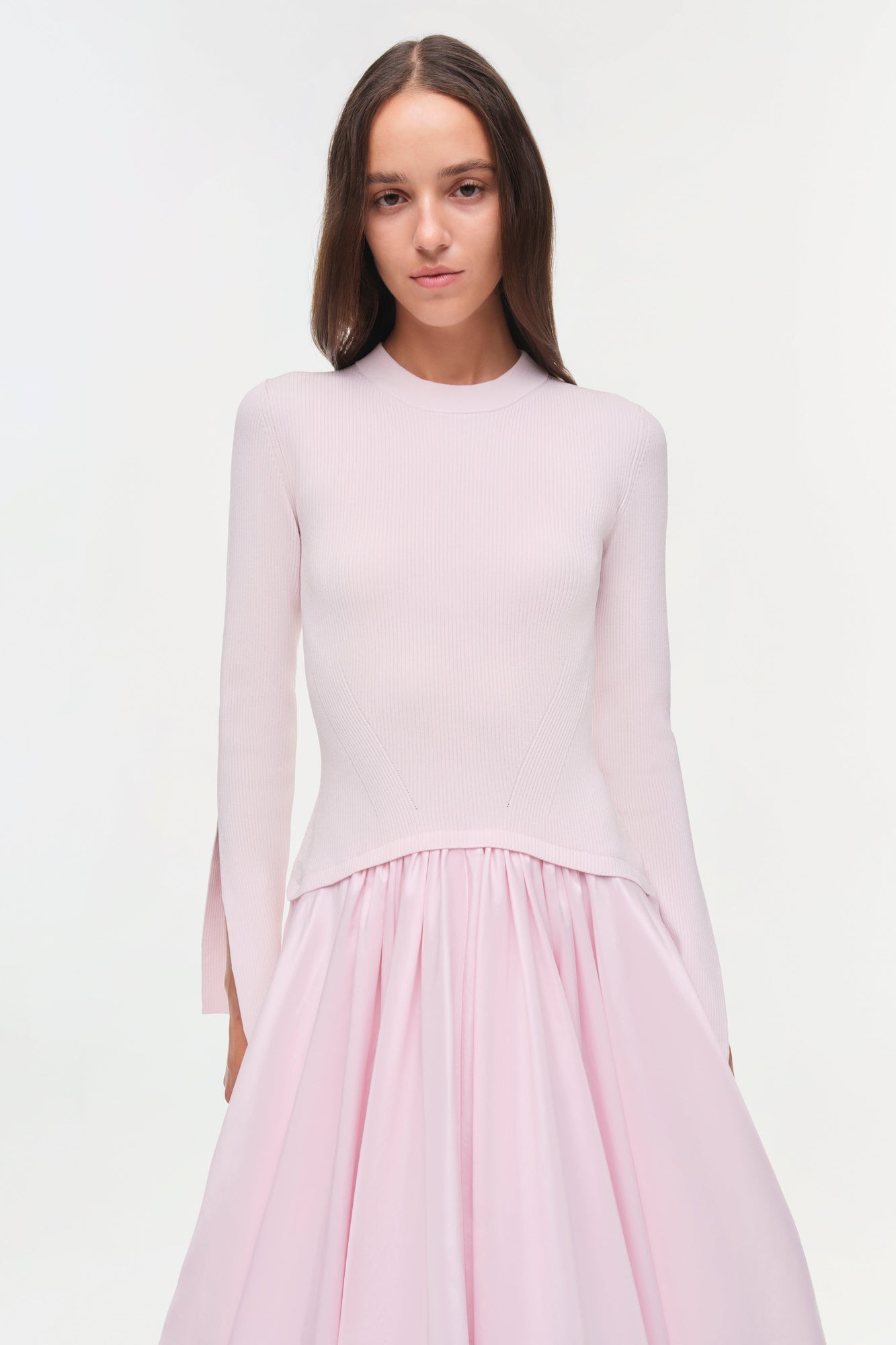 Light pink midi dress with ribbed knit long-sleeve top and pleated taffeta skirt.