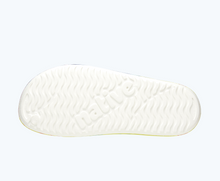 Bottom view of a Native Shoes Spencer Lx Print | Shell White/ Shell White/ Neon Multi Tie Dye Footwear