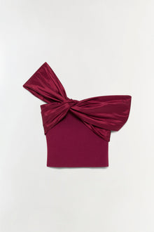 Burgundy off-shoulder top with gathered bow detail at neckline and ribbed fabric body.