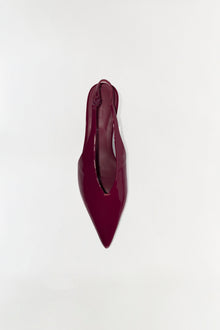 Burgundy slingback heel with pointed toe and thin ankle strap, viewed from above.