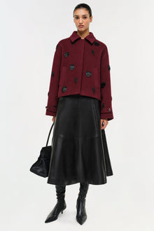 Burgundy wool jacket with black beaded embellishments, collared neckline, and button front closure.