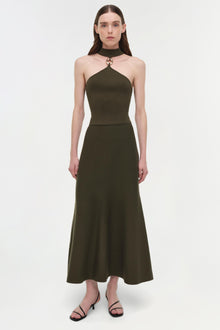 Olive green wool halter top with metal ring detail at neckline, paired with matching midi skirt.