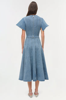 Light blue denim dress with short sleeves, vertical seaming detail, and full skirt shown from back view.