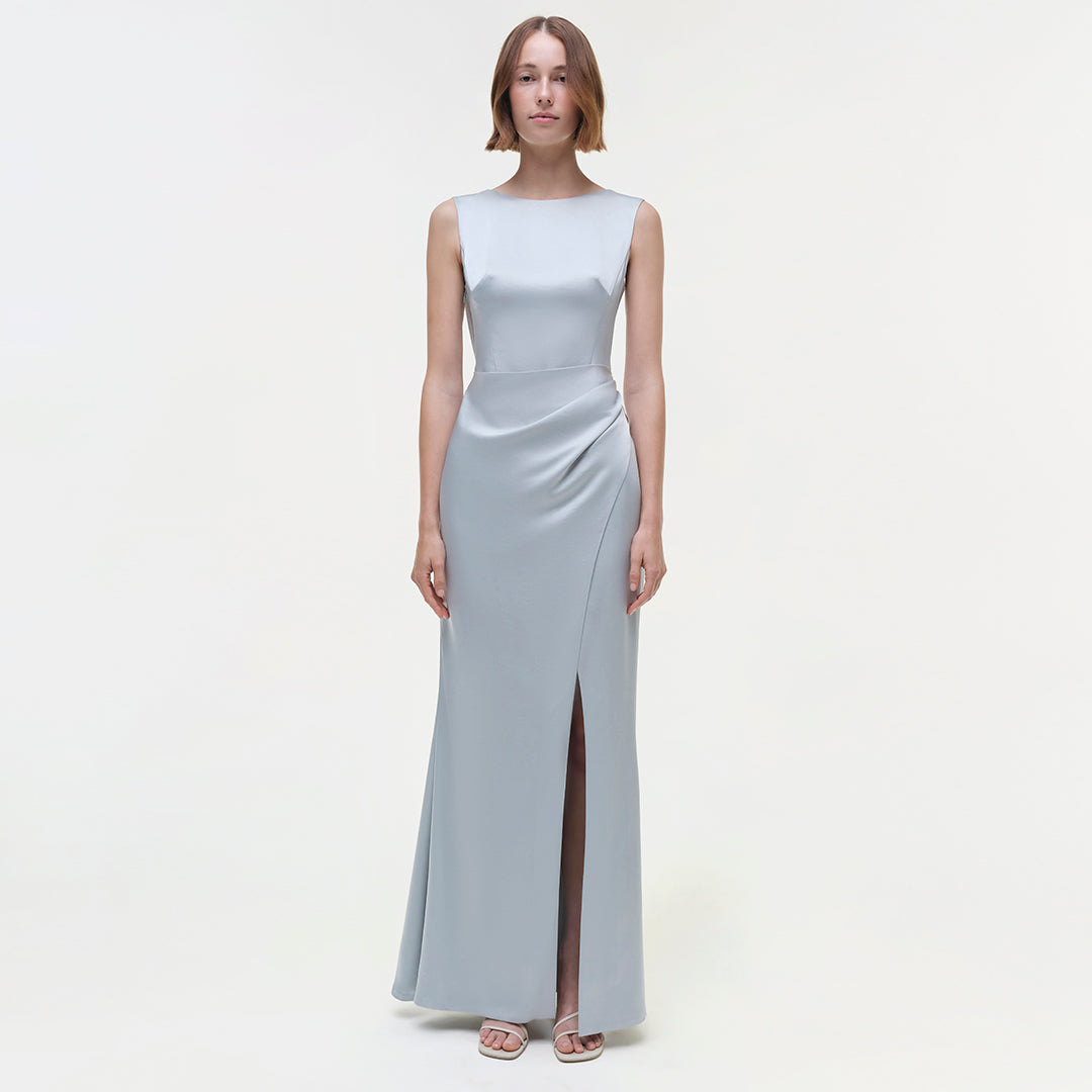 Light blue sleeveless floor-length gown with draped waist detail and side slit.