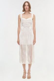 White sleeveless midi dress with geometric pleated pattern and fringe hem detail.