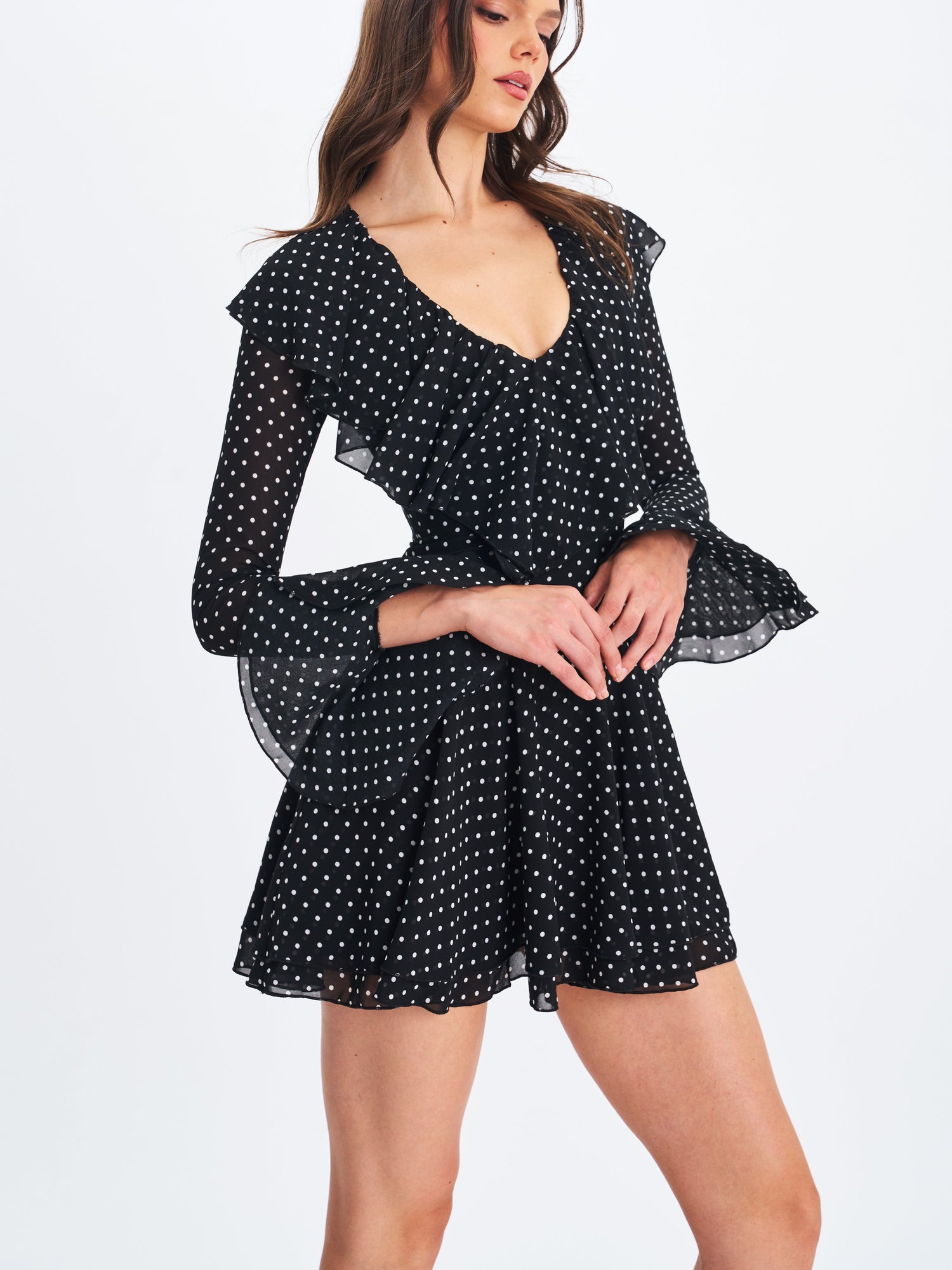 Omari Chiffon Polka Dot Ruffled Neckline Mini Dress | Black