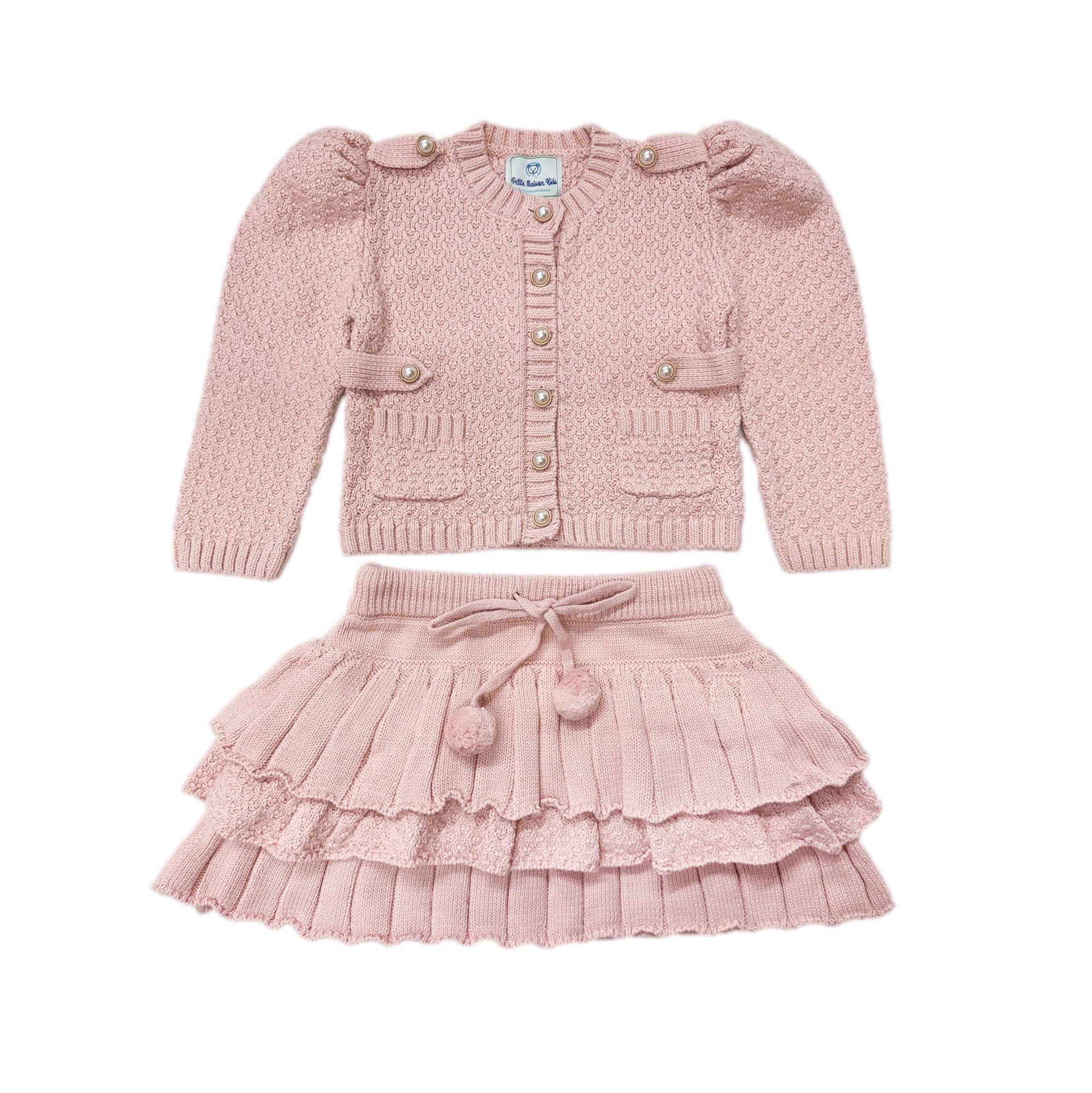 Julie pink knit cotton top and skirt set with pearl buttons and ruffle skirt, girls outfit flat lay