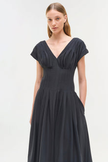 Black cotton midi dress with short sleeves, V-neckline, and pleated bodice and skirt.
