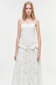 White strapless midi dress with all-over leaf embroidery pattern and sweetheart neckline.