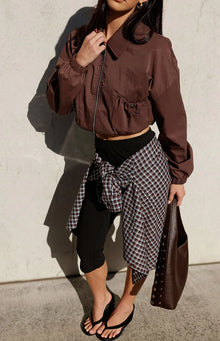 Chocolate cropped bomber jacket with a collar, full zip, and side drawstring hem detail