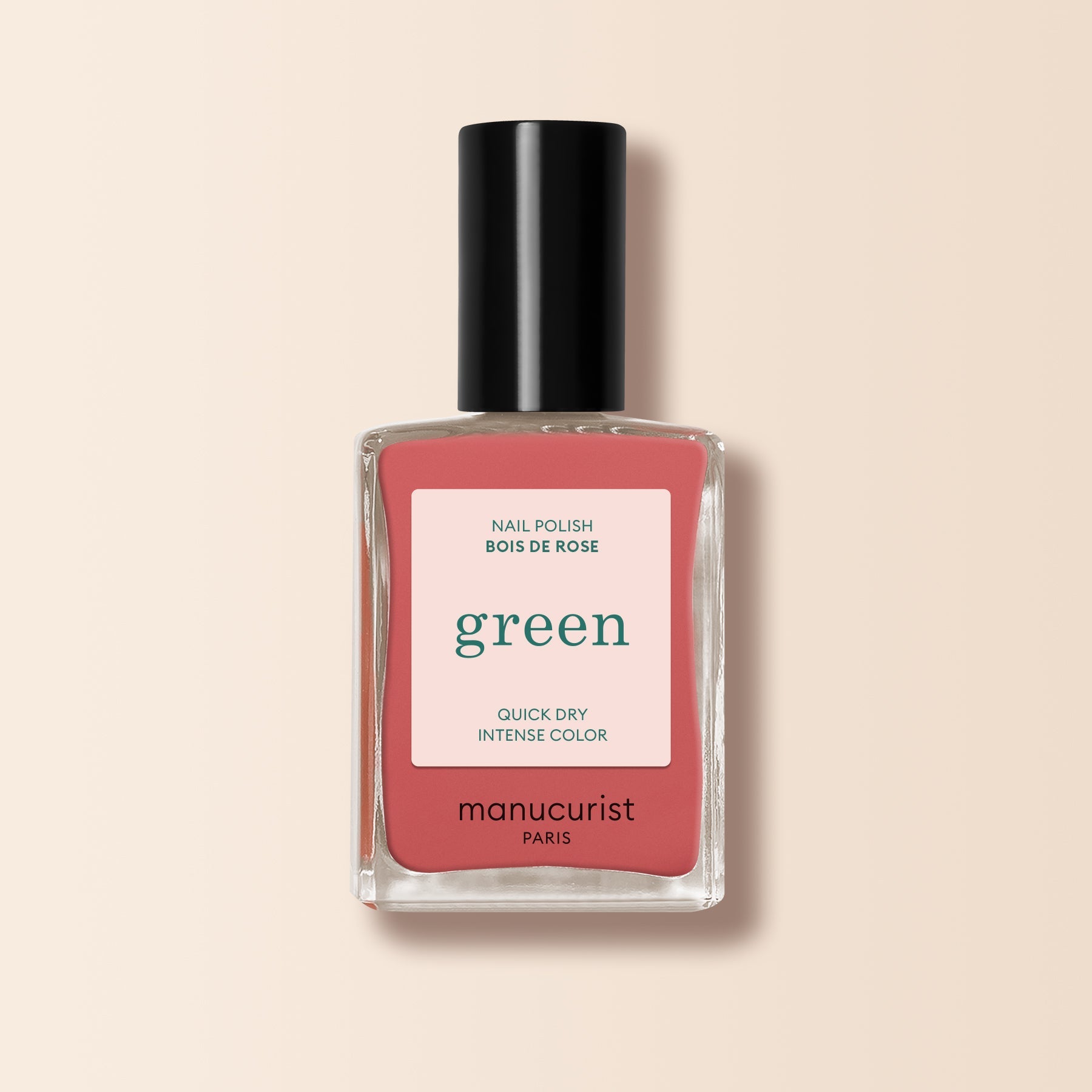 Manucurist's Bois de Rose nail polish features a dusty pink shade with a pink "green" label, delivering quick-dry, intense color on a pale beige background.
