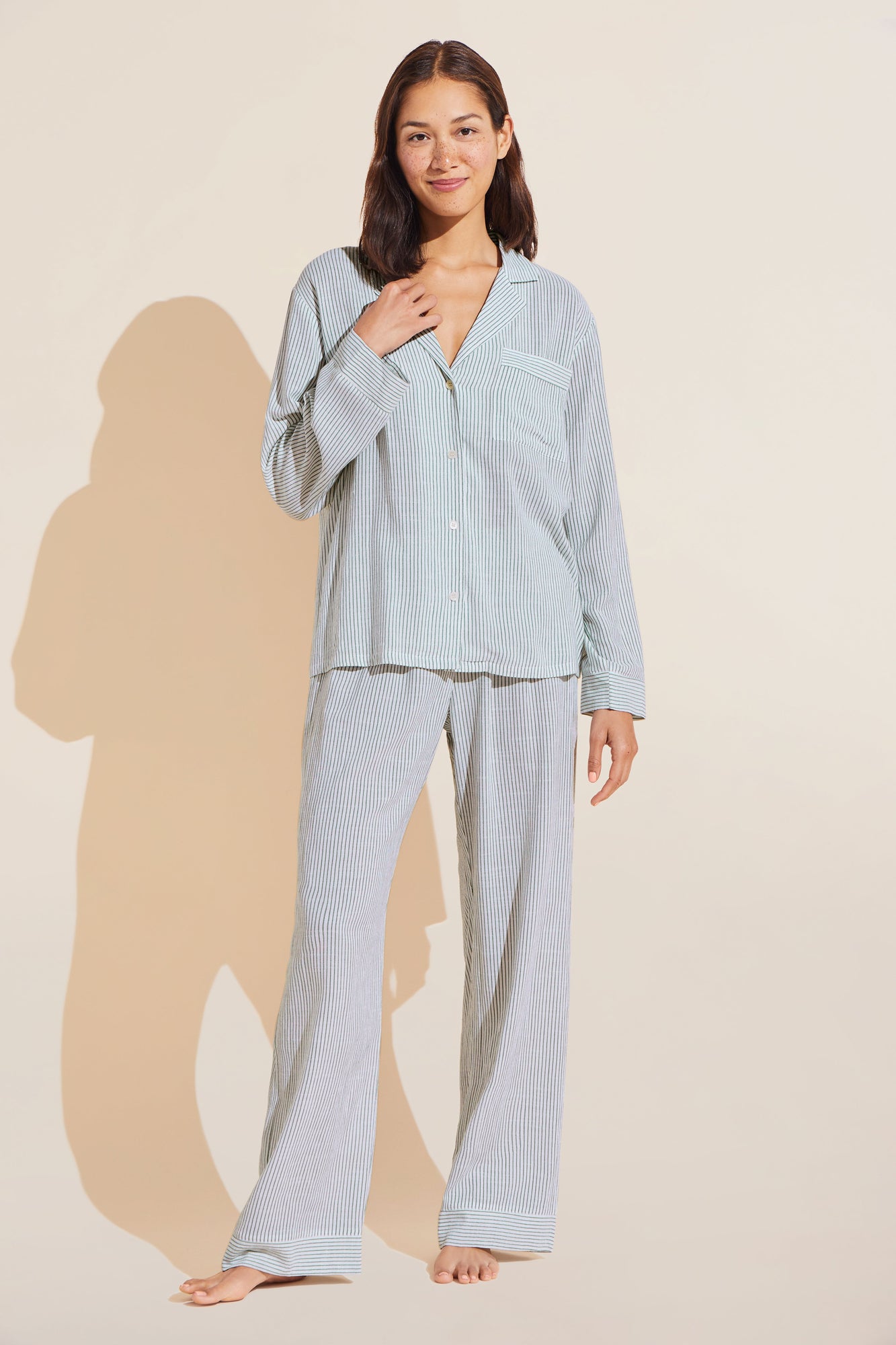 Model wears Nautico Long PJ Set in nautico white and green stripe.