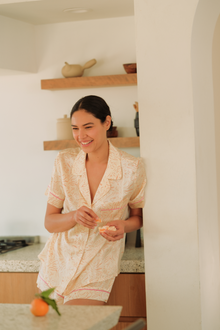 Model wears Inez Washable Silk Printed Short PJ Set in marble rose cloud print.