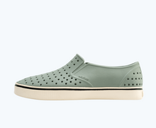 Side view of a Native Shoes Adults Miles Wanderfoam | Relax Green/ Bone White Footwear