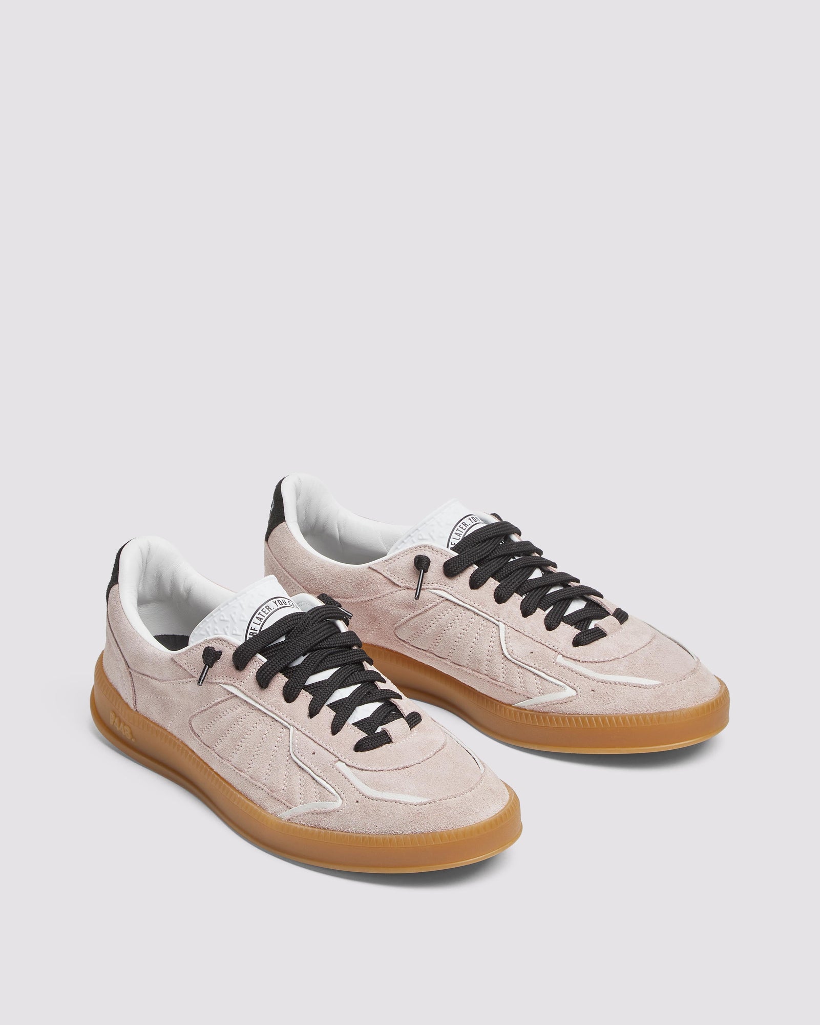 Back angle of light pink and black sneakers