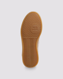 Bottom angle of light pink and black sneakers