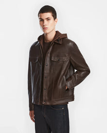 A man in a Rudsak AREN - 6124580 Espresso men’s leather shirt jacket with a hoodie dickie.