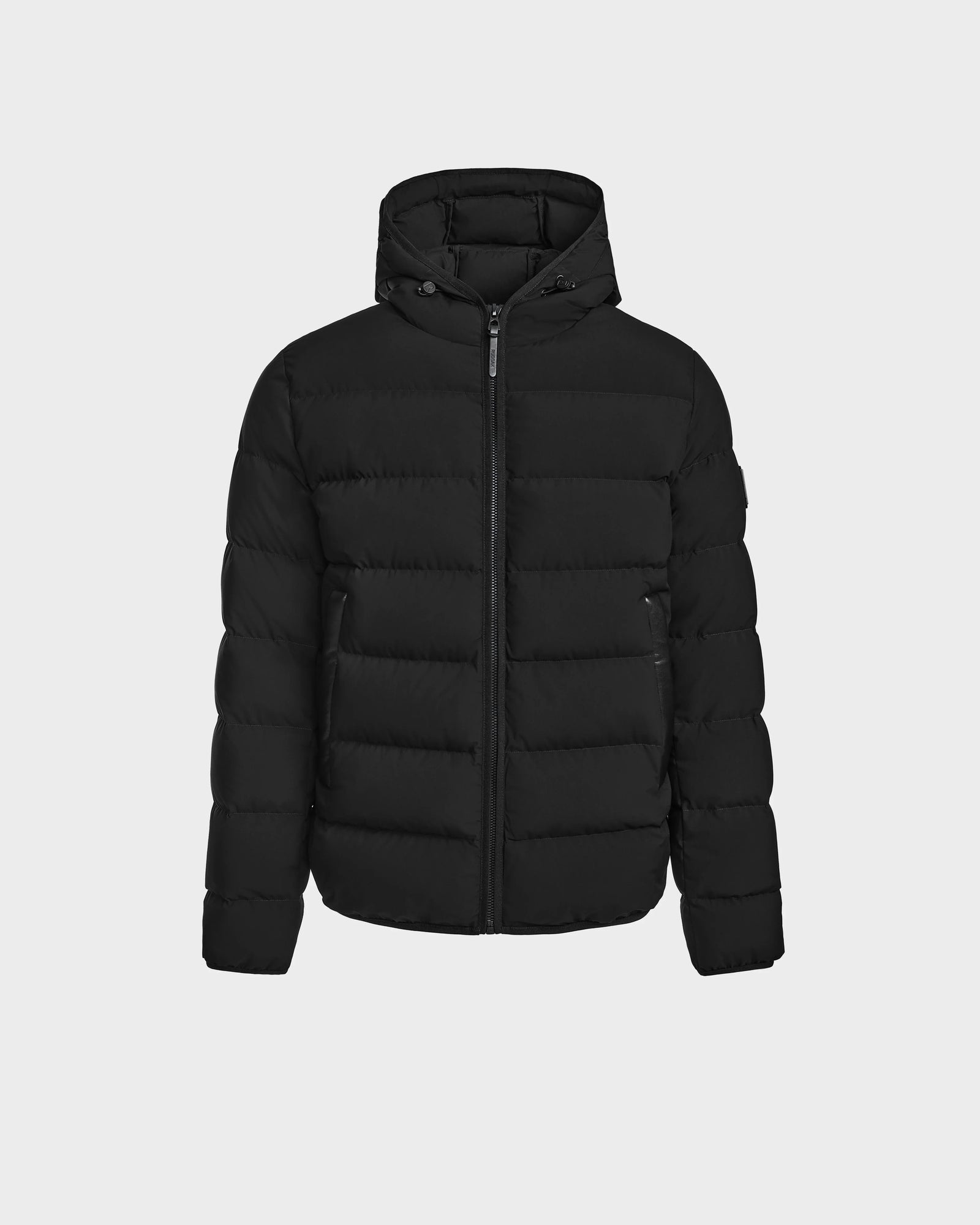 The DEMIAN M - M123507 Black by Rudsak is a black hooded down puffer jacket with a front zipper and horizontal quilting, made from sustainable recycled fabric, shown against a plain light background.