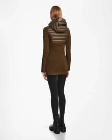 A woman wearing the Rudsak MARRY - L121003 Light Olive down jacket with waterproof zippers.