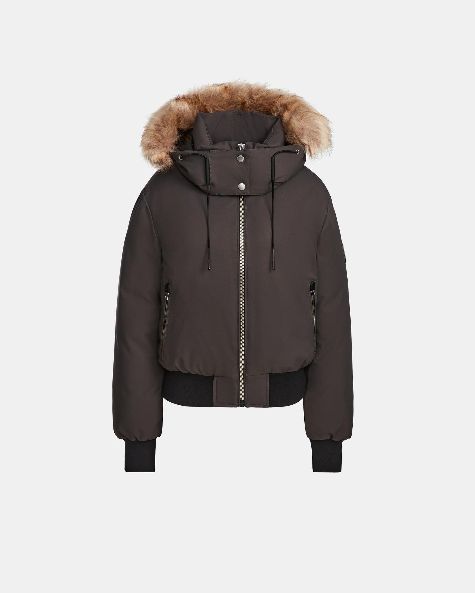 The Rudsak MAUDE - L124522 Grey is a women's winter jacket featuring premium down insulation, a front zipper, two zippered pockets, ribbed cuffs and hem, and an attached hood with brown faux fur trim. The background is plain white.