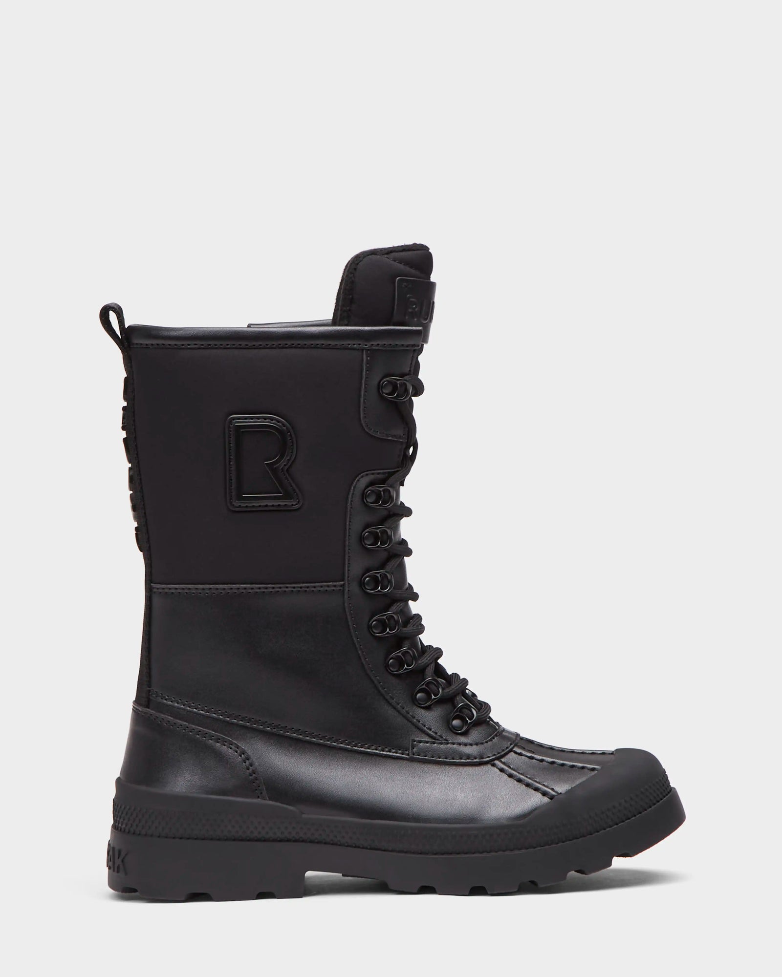The Rudsak RITA - L222502 Black is a women’s high-top black winter boot with weather-treated leather upper, lace-up front, rugged sole, reinforced toe, and side logo patch, shown from the side on a white background.