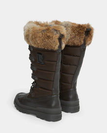 WINDY - L224507 Espresso by Rudsak: tall, dark brown women’s winter boots with faux fur trim, lace-up fronts, quilted sides, thick rubber soles, and a prominent R logo for added cold-weather comfort.