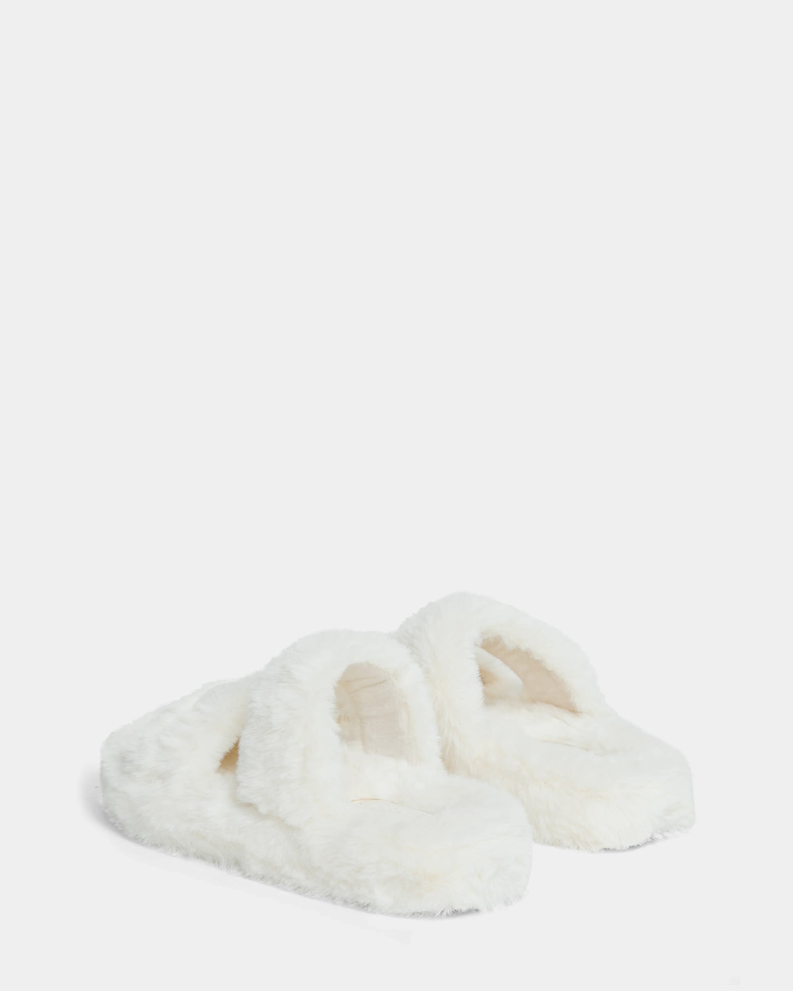 The Rudsak ZETA - 8224508 Iceland womens faux fur slippers feature a cozy closed toe, backless design, and plush indoor comfort, shown on a plain white background.